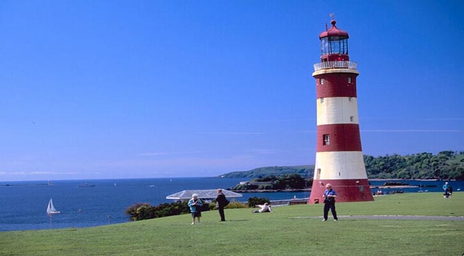 A view towards the Ocean with a lighthouse on the coast